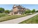 Corner lot townhome with side yard and charming architectural details at 14833 E Crestridge Dr, Centennial, CO 80015