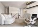 Comfortable loft featuring plush seating, a work area, and plenty of natural light at 14833 E Crestridge Dr, Centennial, CO 80015