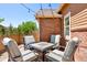 Patio featuring comfortable seating around a modern fire pit with string lights overhead at 14833 E Crestridge Dr, Centennial, CO 80015