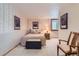 Relaxing bedroom features neutral wallpaper, a comfortable bed, and ample lighting for a serene retreat at 10130 E Powers Ave, Greenwood Village, CO 80111
