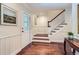 Bright foyer with hardwood floors, elegant staircase, and decorative details at 10130 E Powers Ave, Greenwood Village, CO 80111