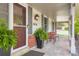 Inviting front porch with seating, a well-maintained entrance, and lovely plants at 10130 E Powers Ave, Greenwood Village, CO 80111