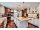 Spacious kitchen with custom cabinets, granite countertops, and a large center island at 10130 E Powers Ave, Greenwood Village, CO 80111
