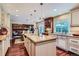 Gourmet kitchen with a large island, granite countertops, and stainless steel appliances at 10130 E Powers Ave, Greenwood Village, CO 80111