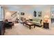 Comfortable living room with classic decor and soft lighting, adjoining the staircase at 10130 E Powers Ave, Greenwood Village, CO 80111