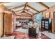 Cozy living room with hardwood floors, brick fireplace, and vaulted ceilings at 10130 E Powers Ave, Greenwood Village, CO 80111
