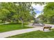 Picturesque park featuring a playground, benches, walking paths, and mature shade trees at 10130 E Powers Ave, Greenwood Village, CO 80111