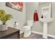 Half bathroom with modern fixtures, pedestal sink, and stylish decor at 13271 Holly St # B, Thornton, CO 80241