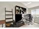 Bedroom with built-in shelving and a desk for a functional workspace at 13271 Holly St # B, Thornton, CO 80241