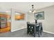 Cozy dining area features modern lighting, stylish decor, and an open view into the adjacent kitchen at 13271 Holly St # B, Thornton, CO 80241