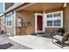 Cozy front porch with seating area, perfect for relaxing and enjoying the outdoors at 13271 Holly St # B, Thornton, CO 80241