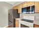 Updated kitchen boasts modern stainless steel appliances and ample cabinet space at 13271 Holly St # B, Thornton, CO 80241