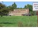 A stone sign that reads 'Thornton Trail Winds Park and Open Space' at 13271 Holly St # B, Thornton, CO 80241