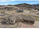 Expansive aerial view of the estate home with a three car garage, circular driveway, and mountain views at 5265 Club Ct, Larkspur, CO 80118