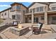 Stone patio with a firepit, perfect for enjoying cool evenings and outdoor relaxation at 5265 Club Ct, Larkspur, CO 80118