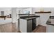 Wet bar features modern cabinetry, countertop space, and nearby entertainment at 5265 Club Ct, Larkspur, CO 80118