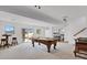 Finished basement boasts an entertainment area, a bar, and scenic outdoor views at 5265 Club Ct, Larkspur, CO 80118