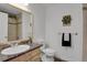 Updated bathroom offers granite counters, tiled shower, and decorative accents at 5265 Club Ct, Larkspur, CO 80118
