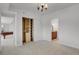 Bedroom with ensuite bathroom and walk-in closet featuring custom shelving at 5265 Club Ct, Larkspur, CO 80118