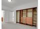 Bedroom closet with custom shelving and built-in drawers, offering plenty of storage space at 5265 Club Ct, Larkspur, CO 80118