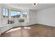 Bonus room offers scenic outdoor views, accent pillows, and wood-look floors at 5265 Club Ct, Larkspur, CO 80118