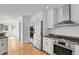 Modern kitchen featuring stainless steel appliances, granite counters, and wood flooring at 5265 Club Ct, Larkspur, CO 80118