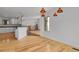 Open-concept living area features hardwood floors and stylish fixtures at 5265 Club Ct, Larkspur, CO 80118