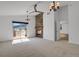 Spacious bedroom with a fireplace, balcony access, and natural light at 5265 Club Ct, Larkspur, CO 80118