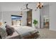 Bedroom with a fireplace, balcony access, and scenic mountain views at 5265 Club Ct, Larkspur, CO 80118