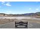 Relaxing outdoor bench overlooking a serene pond with geese and a picturesque mountain backdrop at 5265 Club Ct, Larkspur, CO 80118