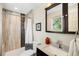 Bathroom featuring a vanity with granite countertops and a shower with elegant tile at 9325 Meade St, Westminster, CO 80031