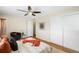 Bedroom with hardwood floors, ceiling fan, and sliding closet doors at 9325 Meade St, Westminster, CO 80031