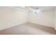 Empty bedroom offering neutral carpeting and a bright window with a light fixture at 9325 Meade St, Westminster, CO 80031