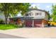 This two-story home has an attached two-car garage and brick and siding exterior at 9325 Meade St, Westminster, CO 80031