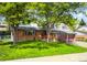 Charming two-story brick home with mature trees and a well-maintained lawn at 9325 Meade St, Westminster, CO 80031