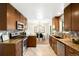 Galley style kitchen showcases granite countertops and stainless steel appliances at 9325 Meade St, Westminster, CO 80031