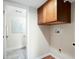 Laundry area with washer/dryer hookups and storage cabinets, offering convenience and functionality at 9325 Meade St, Westminster, CO 80031