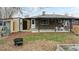 Large backyard with patio, shed, and firepit at 1242 Elder St, Denver, CO 80221