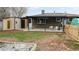 Backyard with patio, shed, and garden at 1242 Elder St, Denver, CO 80221
