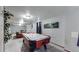Basement game room with air hockey table at 1242 Elder St, Denver, CO 80221