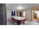 Basement game room with air hockey table and bathroom at 1242 Elder St, Denver, CO 80221