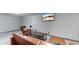 Finished basement recreation area with sectional sofa and TV at 1242 Elder St, Denver, CO 80221