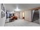 Finished basement includes recreational space, additional room, and stair access at 1242 Elder St, Denver, CO 80221
