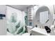 Updated bathroom with white subway tiles and a stylish vanity at 1242 Elder St, Denver, CO 80221