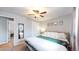 King-size bed, ample closet space, and large window in this bedroom at 1242 Elder St, Denver, CO 80221