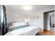 Bright bedroom with a king-size bed and teal curtains at 1242 Elder St, Denver, CO 80221