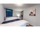 Spacious basement bedroom with a queen bed and plenty of closet space at 1242 Elder St, Denver, CO 80221