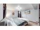 Comfortable basement bedroom with a queen bed and wall art at 1242 Elder St, Denver, CO 80221