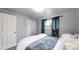 Serene bedroom with a comfortable bed, soft lighting, and stylish curtains at 1242 Elder St, Denver, CO 80221