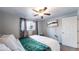 Comfortable bedroom with a king-size bed and a large window at 1242 Elder St, Denver, CO 80221